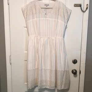 White Dress with embroidered details.